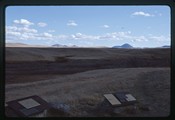 Battle of Bear Paw site - Bears Paw Mountains behind educational plaques
