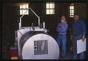 Choteau, Montana - Ivan Doig and Bob Facklam stand behind machinery at Teton Welding