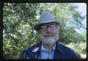 Ivan Doig smiling at camera in denim jacket