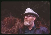 Ivan Doig above the shoulders wearing leather jacket and cowboy hat