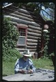 Polebridge, Montana - Ivan Doig looking at photographs of 1988 fire (closeup)