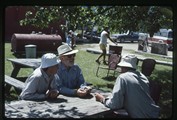 Polebridge, Montana - Carol and Ivan Doig viewing photographs of the 1988 fires with Jerry DeSanto 2