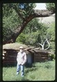 Ivan Doig standing at Dugout cabin Ranch