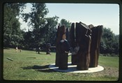 Ivan Doig sits within wooden sculpture