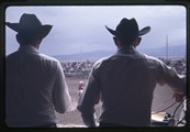 Two people watch the White Sulphur Springs rodeo in Montana