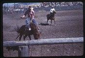Two men on horses at White Sulphur Springs rodeo