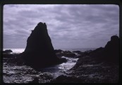 Tidal trough under jagged rocky shoreline