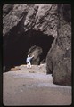 Ivan Doid stands in a cave at Point of Arches