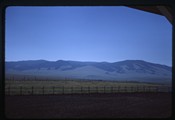 Landscape of ranch land at the base of mountains