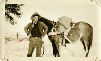 Charlie Doig with a horse carrying his kill