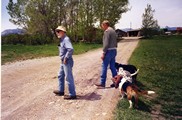Bill Rappold, Ivan Doig, and three dogs at Rappold Ranch in Dupuyer, Montana
