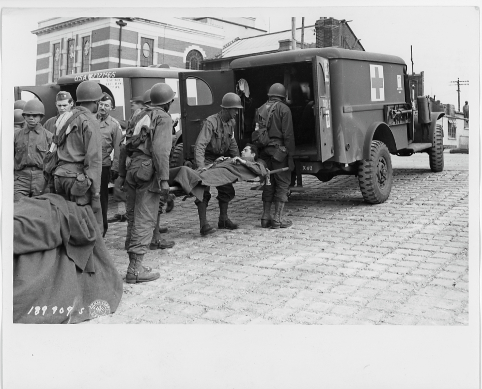Wounded soldier lifted into an ambulance