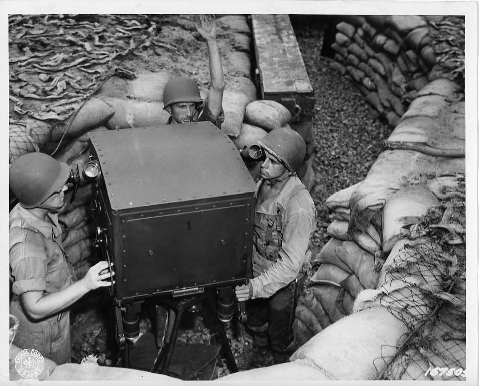 The control station crew working the director of a gun
