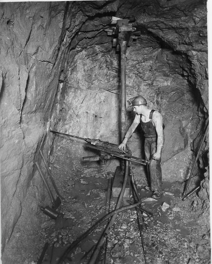 Miner with rock drilling machinery