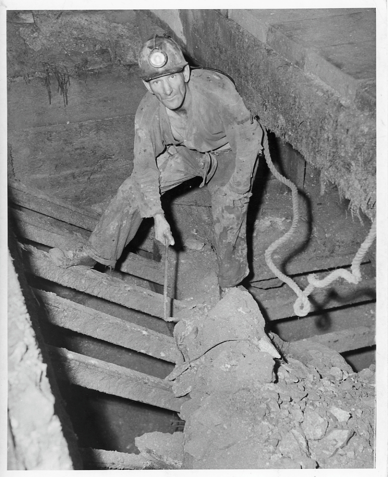 Miner wearing a safety belt