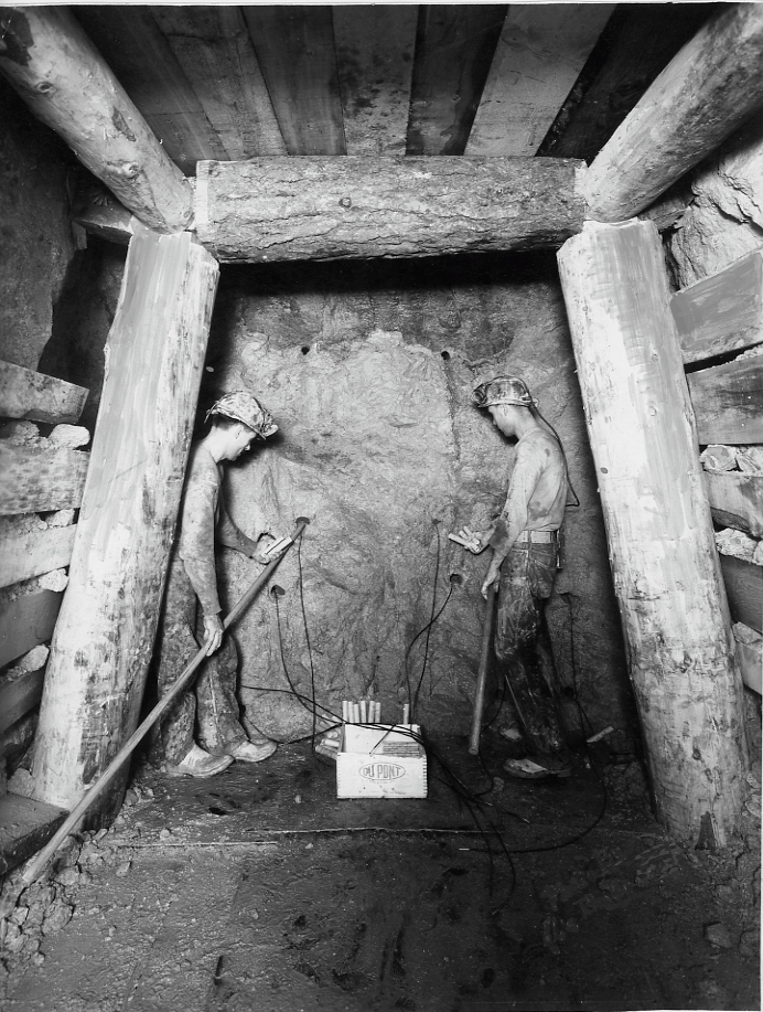 Butte miners loading dynamite for blast