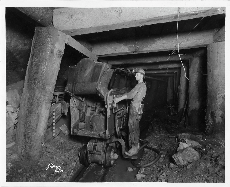 Miner working with mine cart