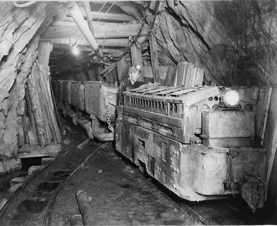 Miner working with mine cart
