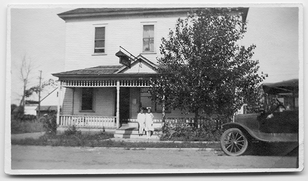 Alberta and Harlan in Front of the Rice Rooming House, Forsyth, Montana