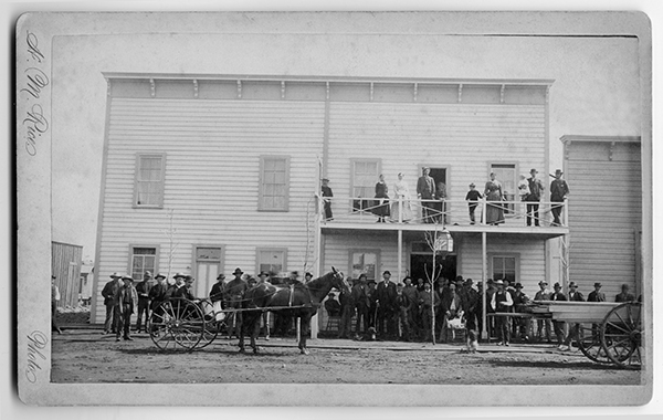 Group of People Standing in Front of Building, Unknown Location