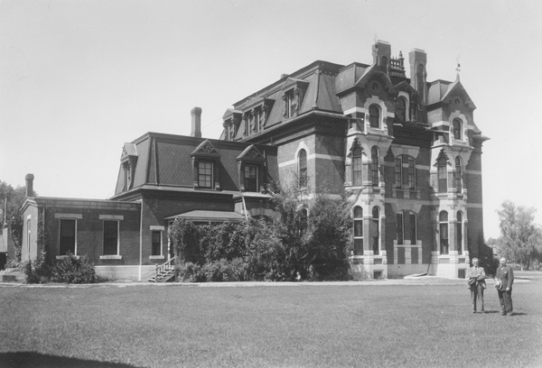 Walter Story and Johnnie Shaeles on East Side of Nelson Story Mansion, Bozeman, Montana