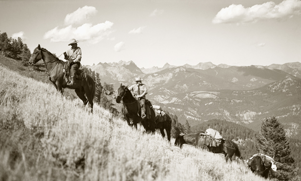 Johnie Hankins and Edwin Harvat with Pack String, Paradise Valley, Montana