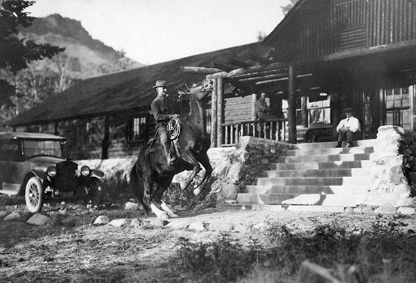 Dick Randall on Horseback in Front of Lodge, OTO Dude Ranch, Corwin Springs, Montana