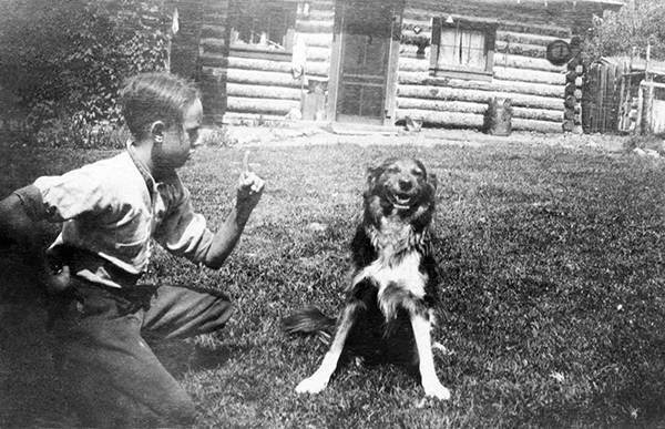 Boy With Dog at OTO Dude Ranch, Corwin Springs, Montana