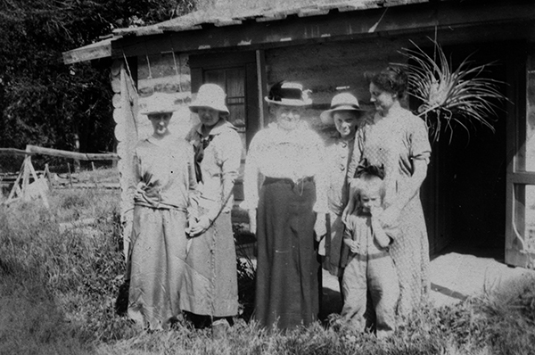 Group In Front of Log Cabin at OTO Dude Ranch, Corwin Springs, Montana