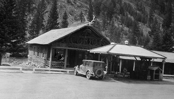 Automobile in front of Karst Kamp and Stage Stop Curio Shop, Gallatin Canyon, Montana