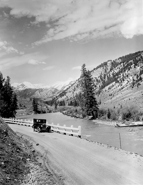 Automobile Going South by Rainbow Ranch, Gallatin Canyon, Montana