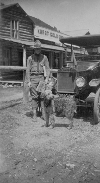 Forest Ranger With Dog at Karst Kamp and Stage Stop, Gallatin Canyon, Montana