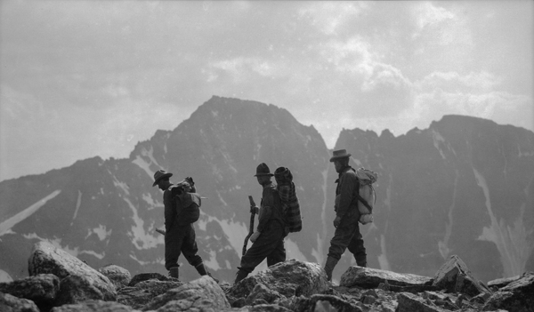 Hikers on Mount Tempest with Granite Peak in Background, Beartooth Mountains, Montana
