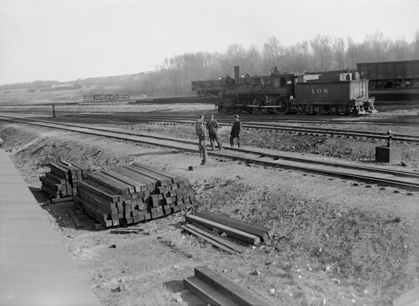 Men on Railroad Tracks With Engine in Background, Harlowton, Montana