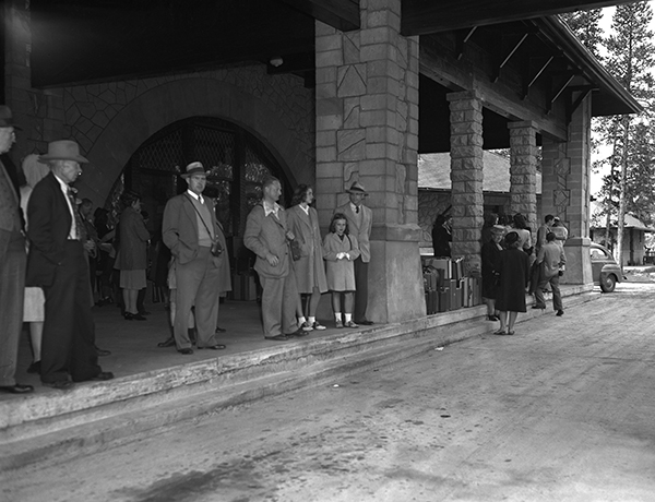 Passengers Waiting for Yellowstone Tour Bus, West Yellowstone, Montana