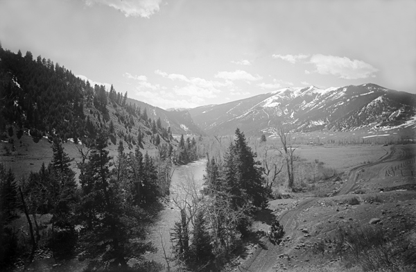 Horse-drawn Wagon on Road Next to West Gallatin River in Gallatin Canyon, Montana