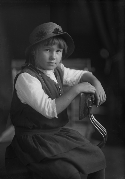 Studio Portrait of Unidentified Girl sitting in Chair, Bozeman, Montana