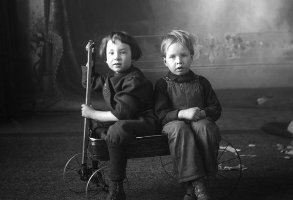 Two Boys Sitting in Wagon, Bozeman, Montana