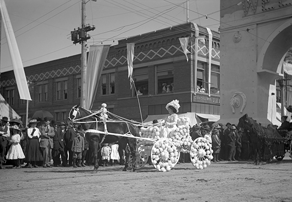 Woman in Horse-Drawn Buggy in the Sweet Pea Carnival Parade, Bozeman, Montana