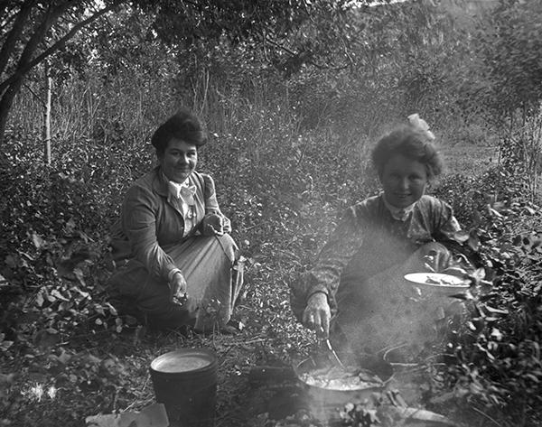 Two Women Cooking over a Campfire, Unknown Location, Montana