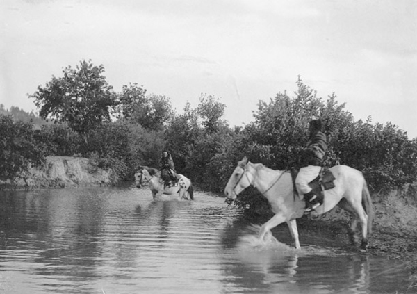 Two Flathead Indians Crossing a River on Horseback, Unknown Location