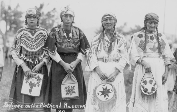 Four Flathead Indian Women in Decorated Clothing, Unknown Location