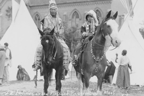 Two Flathead Indians on Horses in Front of the St. Ignatius Mission, St. Ignatius, Montana
