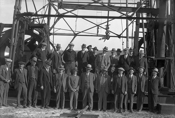 Group Portrait in Front of Oil Drilling Tower, Gallatin Valley, Bozeman, Montana