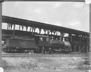 The crew of NP 85 pose by the car shed in Livingston MT on August 19, 1898. 