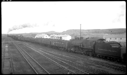 NP 2410, Class T dead, on way to scrap yard at Brainerd on X5011E leaving Glendive. Train also moved dead engine NP 1708 being transferred to Fargo Div. 
