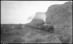 NP 2242, Class Q-5 with NP train No. 3 in badlands 2 miles west of Glendive