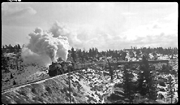 NP 1761, Class W-3 and NP 2605, Class A doubleheading with train No.1 approaching Spire Rock on Butte Mountain 