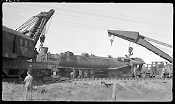 NP 2650, Class A-2 derailed while hauling Train No. 2 at Galen, MT.  Derailment caused by open switch and train striking car of beets on spur.  View wreckers lifting on NP 2650.