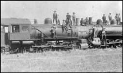 Head-on Collision of NP 124, Class S-2c and NP 117, Class S-2c near Sweet Briar, ND. Lots of people standing on engines posing for camera.